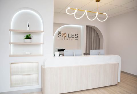 Reception desk and arched shelving at Y3 Smiles Dental
