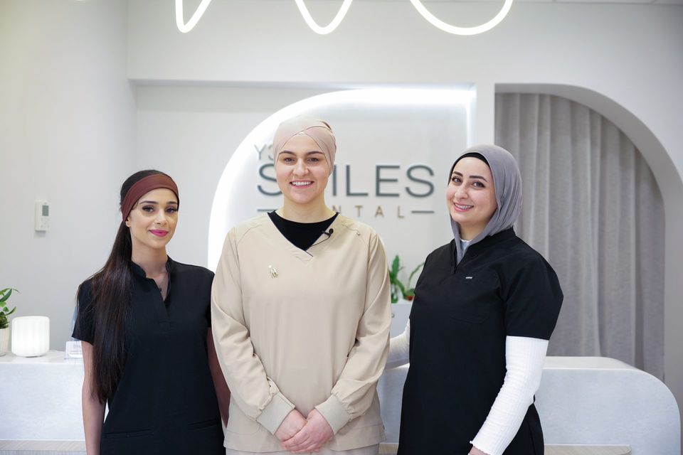 Dr Fatima Kurnaz with two members of the Y3 Smiles Dental team at reception