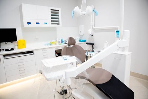 Treatment room with dental chair and cabinetry at Y3 Smiles Dental