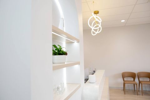 Waiting area with timber shelving and seating at Y3 Smiles Dental